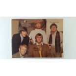 POP MUSIC, signed colour magazine photo by Brian Wilson showing the full band, 9.5 X 7.25, VG