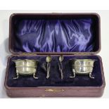 A pair of late Victorian silver salts, each with wavy rim, on scalloped feet, Birmingham 1900,