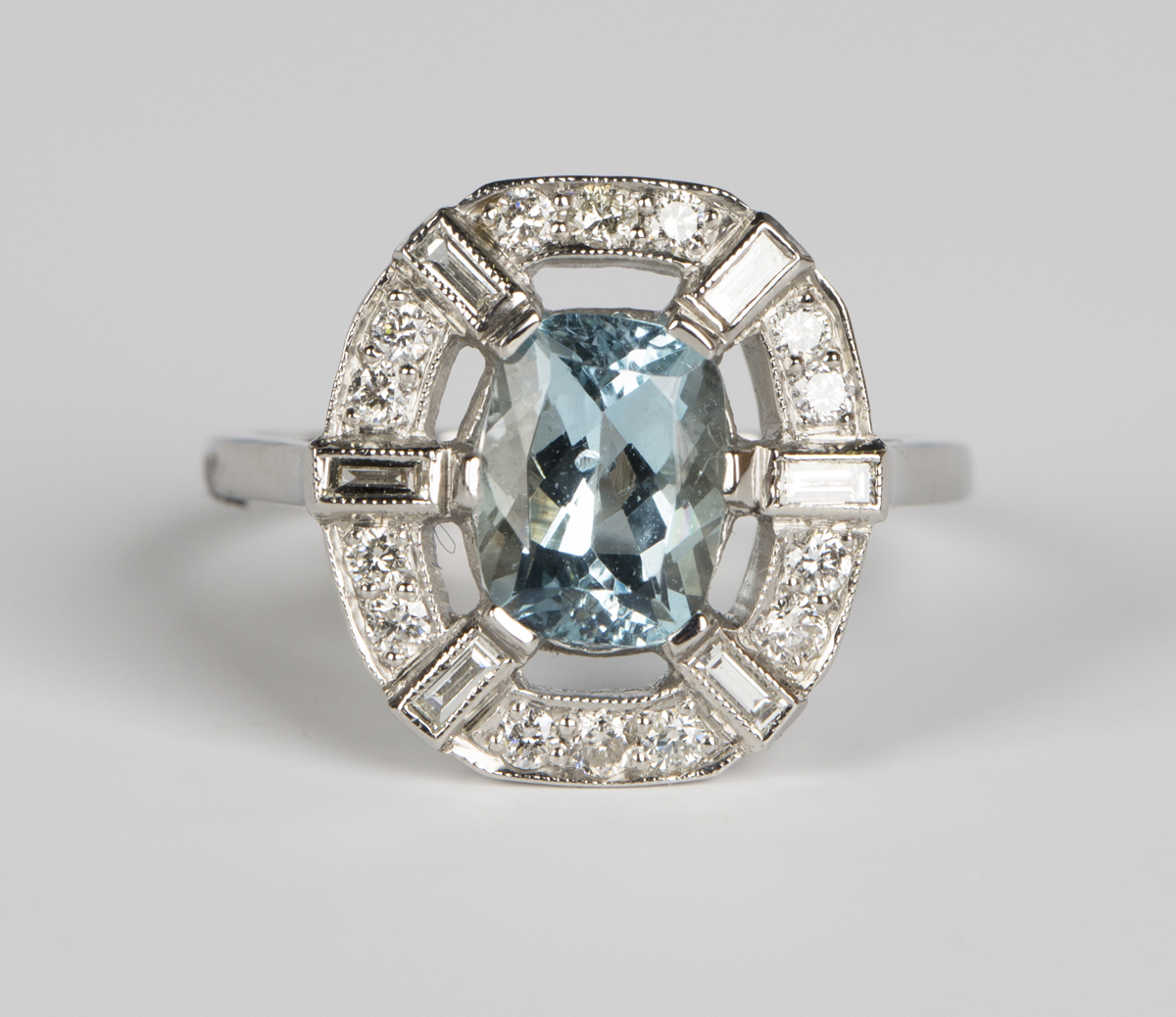 An aquamarine and diamond ring, claw set with an oval cut aquamarine within an openwork surround, - Image 5 of 5