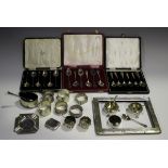 A collection of assorted silver items, including a pair of George V silver napkin rings,