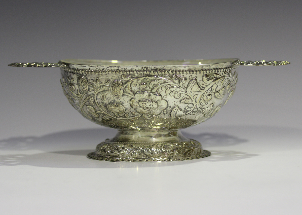 A 19th century Continental silver oval bowl, the body decorated in relief with a band of flowers and