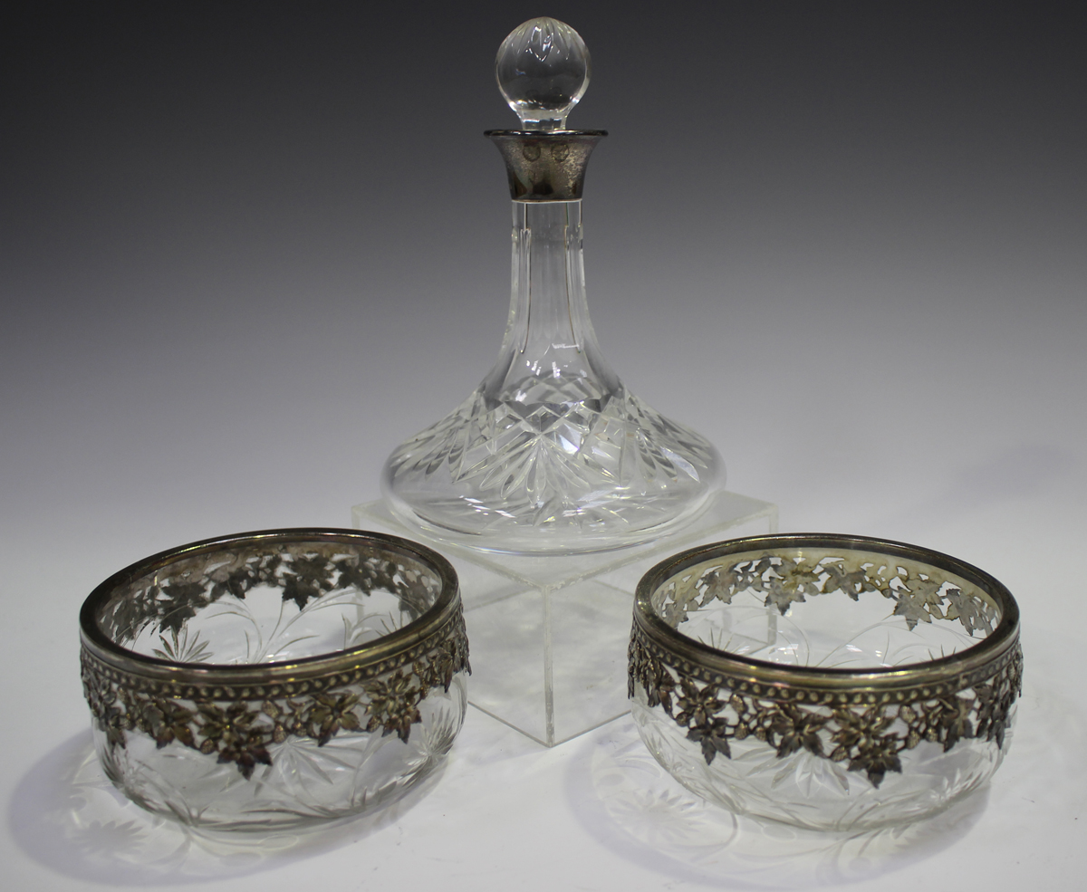 A pair of Continental silver mounted cut glass circular bowls, pierced with trailing vines, diameter