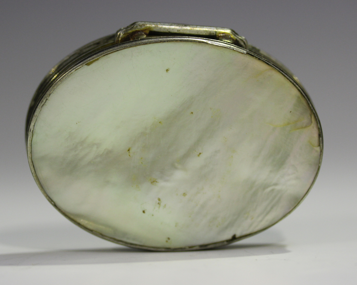 A mid to late 18th century silver mounted mother-of-pearl oval snuff box, the hinged lid carved in - Image 3 of 5