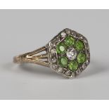 A gold and silver set, diamond and demantoid garnet hexagonal cluster ring, mounted with the