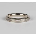 An 18ct white gold and diamond half eternity ring, channel set with a row of circular cut