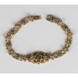 A gold, emerald and diamond bracelet, the front mounted with a cabochon emerald five stone set