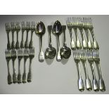 A silver harlequin part canteen of Fiddle pattern cutlery, comprising four tablespoons, nine table