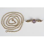 A 9ct gold, amethyst and seed pearl bar brooch with thistle motifs, Birmingham 1906, weight 2.5g,