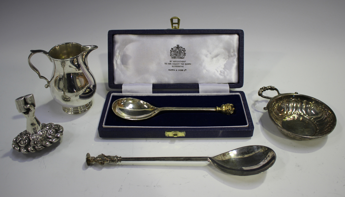 A George V silver apostle spoon, Birmingham 1914, length 18cm, a silver and parcel gilt Silver