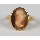 An 18ct gold and oval banded cornelian cameo ring, carved as a portrait of a gentleman, Chester