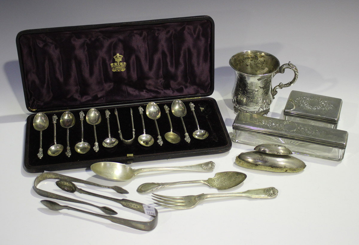 A set of eleven late Victorian silver apostle teaspoons and a pair of matching sugar tongs,