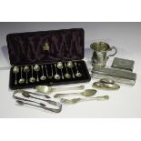 A set of eleven late Victorian silver apostle teaspoons and a pair of matching sugar tongs,