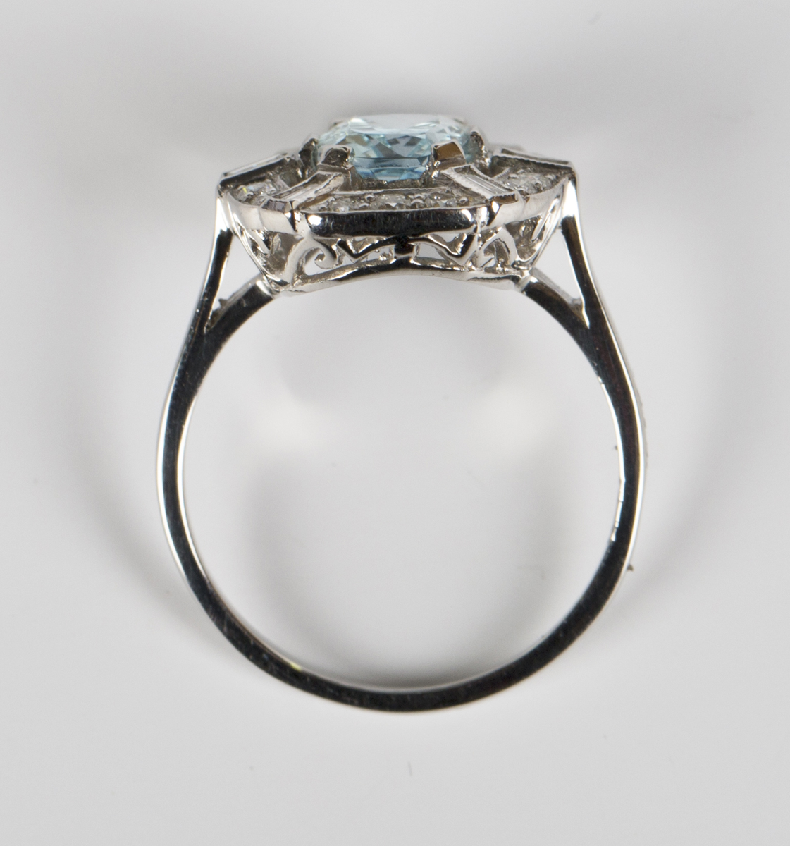 An aquamarine and diamond ring, claw set with an oval cut aquamarine within an openwork surround, - Image 3 of 5