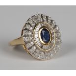 An 18ct gold, sapphire and diamond oval cluster ring, mounted with the oval cut sapphire within a