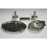 An Edwardian silver oval teapot stand, engraved with a vacant shield shaped cartouche and bellflower
