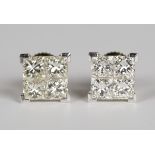 A pair of 18ct two colour gold and diamond earrings, each of square form, mounted with four princess