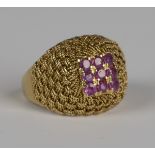 A gold and ruby nine stone square cluster ring in a woven wirework design, detailed '750', weight