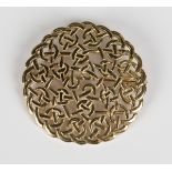 A Scottish 9ct gold brooch of shaped circular form, pierced in a Celtic inspired design, weight 7.