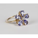 A 9ct gold, mauve and colourless gem set ring in a flowerhead shaped design, weight 2.2g, ring