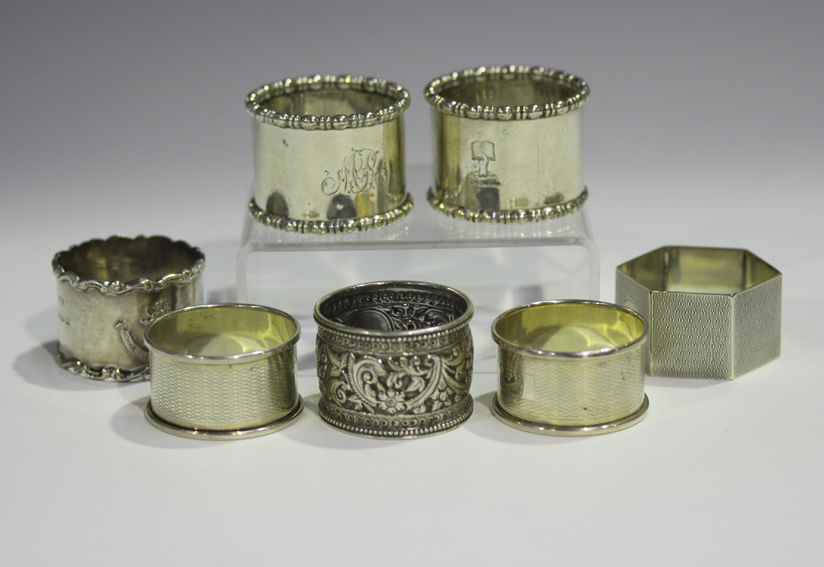 A pair of Edwardian silver napkin rings with beaded rims, Sheffield 1904 by Atkin Brothers, together