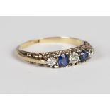 An 18ct gold, sapphire and diamond ring, claw set with three circular cut diamonds alternating