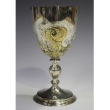 An Elizabeth II silver and parcel gilt goblet, the ovoid bowl decorated in relief with a crown and