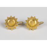 A pair of gold earrings, each in an Etruscan design of circular form with applied wirework and
