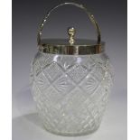 An Edwardian silver mounted cut class biscuit barrel and cover with swing handle, Birmingham 1904 by