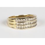 A 9ct gold and diamond ring, mounted with three rows of circular cut diamonds, detailed '.50',