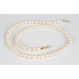 A single row necklace of uniform cultured pearls on a 9ct gold clasp, London 1988, length 42.5cm,