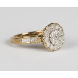 A 9ct gold and diamond cluster ring, mounted with circular cut diamonds between diamond set