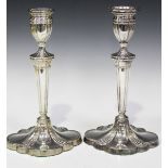 A pair of Elizabeth II silver candlesticks of Neoclassical style on spreading feet, Sheffield 1997