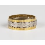 An 18ct two colour gold wide band ring with foliate decoration, London 1960, weight 4.3g, ring