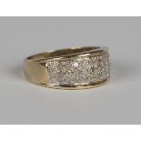 A 9ct gold and diamond ring, mounted with three rows of circular cut diamonds, detailed 'Dia 0.