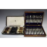 A set of twelve Edwardian plated dessert knives and forks with mother of pearl handles by Walker &