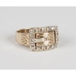 A 9ct gold and diamond ring, designed as a buckle and strap, mounted with circular cut diamonds,