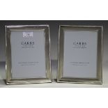 A pair of Elizabeth II silver mounted rectangular photograph frames, each with gadrooned edge,