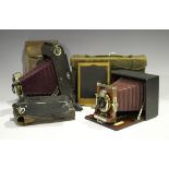 An early 20th century Manhattan Optical Co 'Cycle Wizard B SR' folding plate camera with mahogany