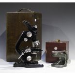 A mid-20th century black enamelled binocular microscope by Watson & Sons, boxed, together with a