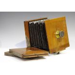 A late 19th century mahogany plate camera by Marion & Co, with gilt brass fittings and dark maroon