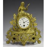 A late 19th century French gilt spelter mantel timepiece, the enamel dial with Roman hours, the case