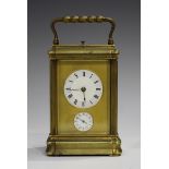 A late 19th century French brass gorge case carriage alarm clock with eight day movement striking