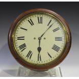 A Victorian mahogany circular wall clock with brass eight day twin fusee movement striking on a