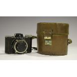 A Nagel 'Rolloroy' camera with E. Leitz Elmar 1:3.5 f=5cm lens, No. 102325, leather cased.Buyer’s