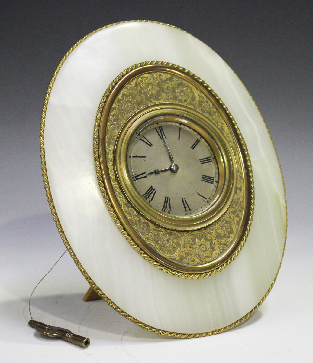 A Victorian onyx and gilt bronze strut timepiece, the drum cased movement with platform