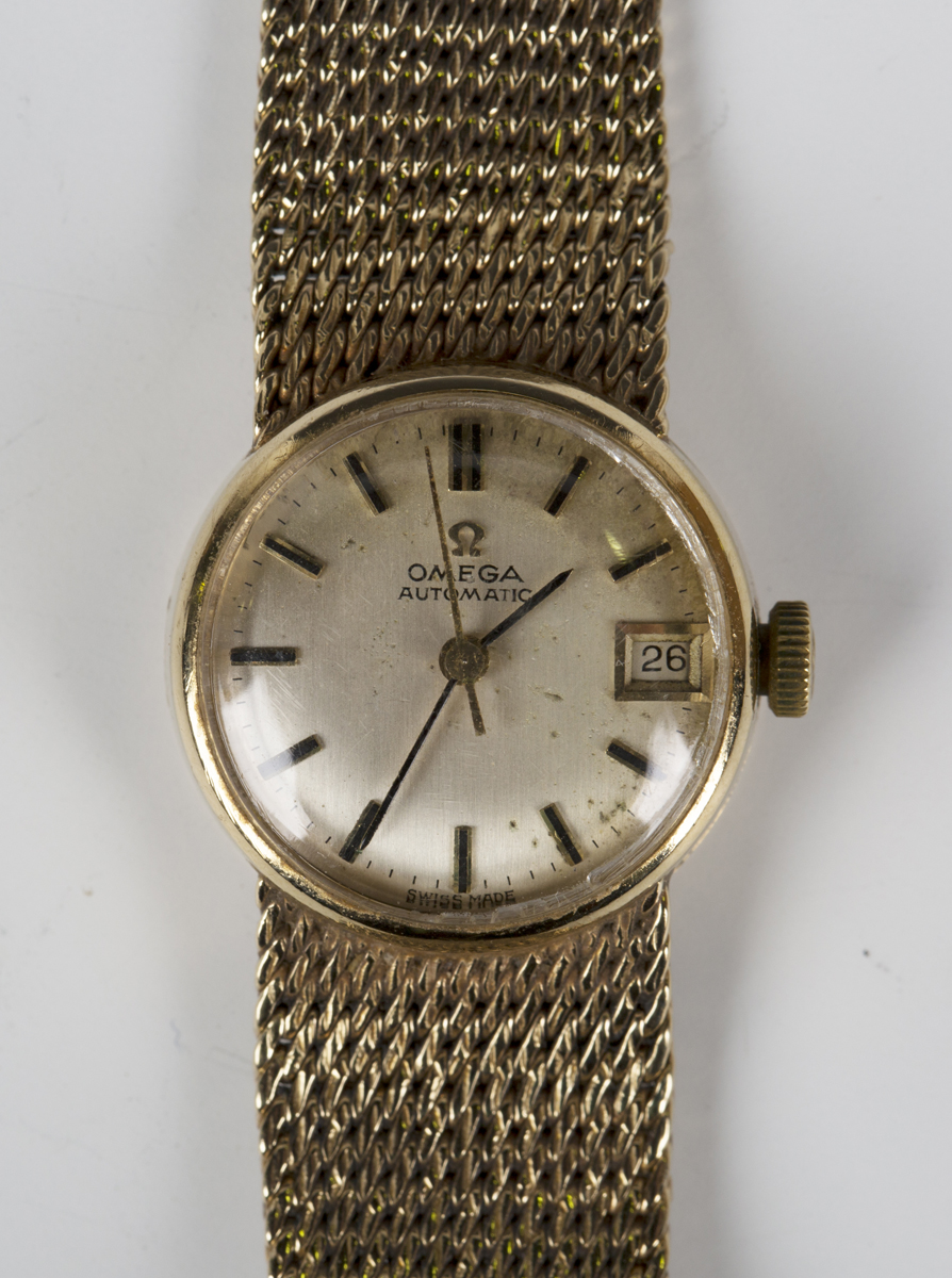 An Omega Automatic 9ct gold lady's bracelet wristwatch, the signed silvered dial with baton hour