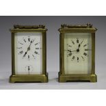 An early 20th century French brass cased carriage alarm clock with eight day movement striking on