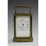 An early 20th century French lacquered brass cased carriage timepiece with eight day movement, the