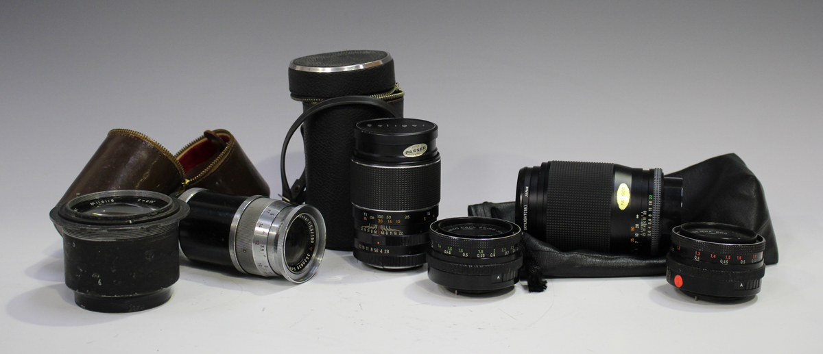 A group of camera lenses, comprising a Schneider-Kreuznach Tele-Xenar 1:5.5/180 lens, No. 3520630, a