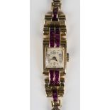A gold and ruby set lady's cocktail watch, circa 1940, the jewelled movement detailed 'Andre Wyler',